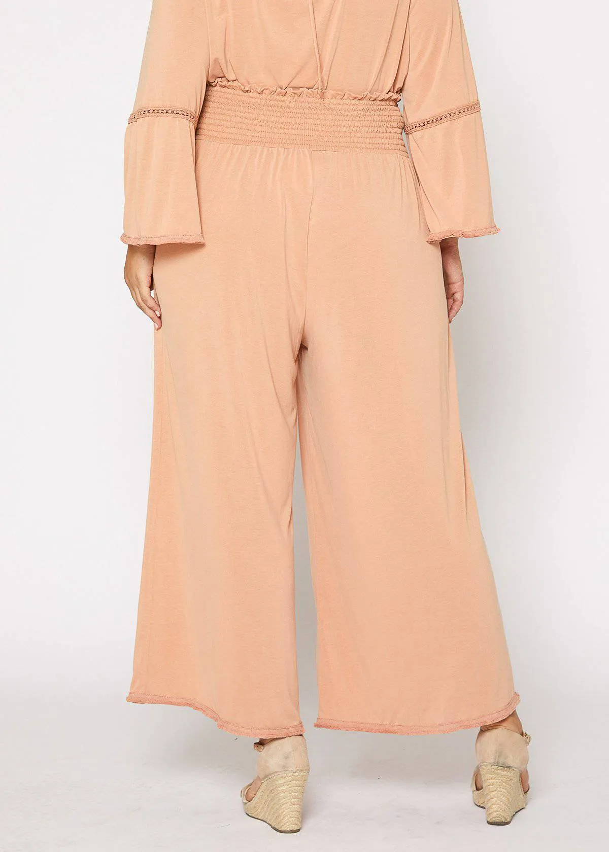 Plus Size Smocked Waist Wide Leg Palazzo Pants in Apricot by Shop at Konus
